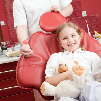 Photo of girl in dental chair - Pediatric dentist Dr. Tricia Ray serving Salem, Keizer, Dallas and Silverton, OR